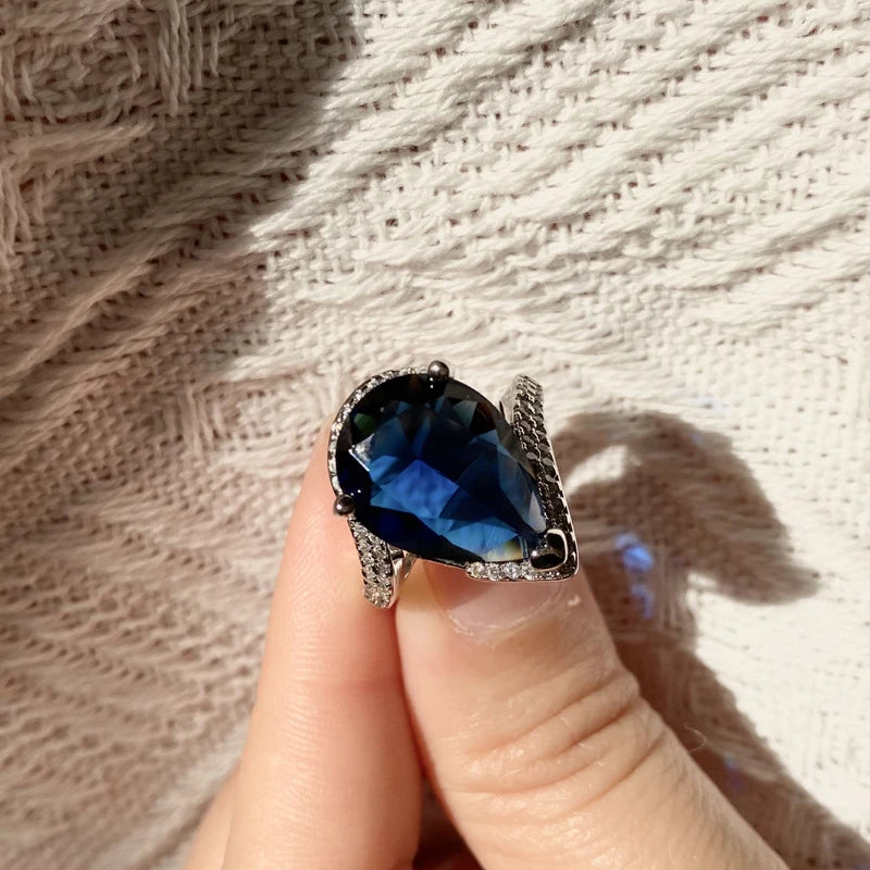 Pear Cut Blue Topaz Ring with Diamond Accents