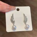 Angel wing pearl earrings