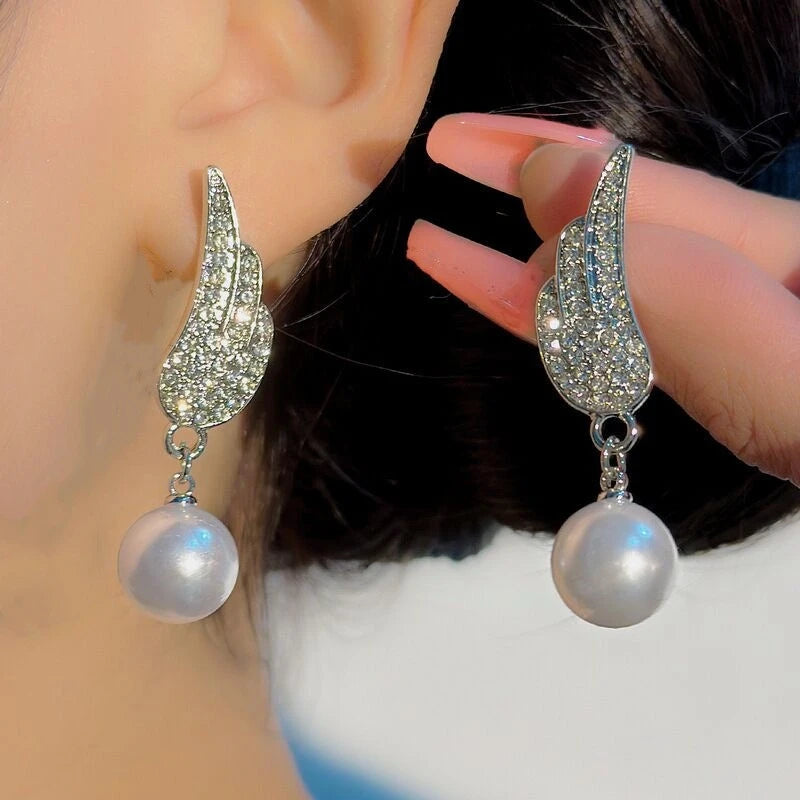 Angel wing pearl earrings