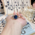 Elegant halo design crystal blue ring