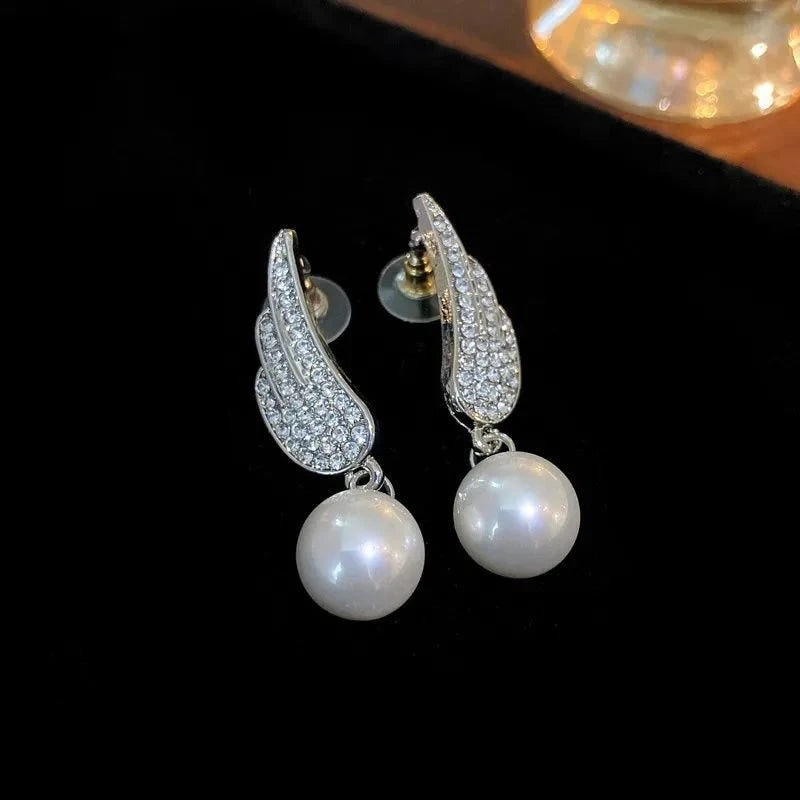 Angel wing pearl earrings