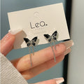 Pretty black color butterfly tassel earrings